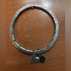 Silver faith bracelet and stretches! I wore it once, I just don’t wear jewelry